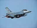 F-16AM of the local 322 Sq in take off. Note the ALQ-131 ECM pod. 